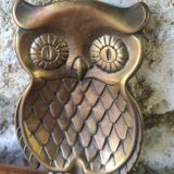 empty brass owl pocket