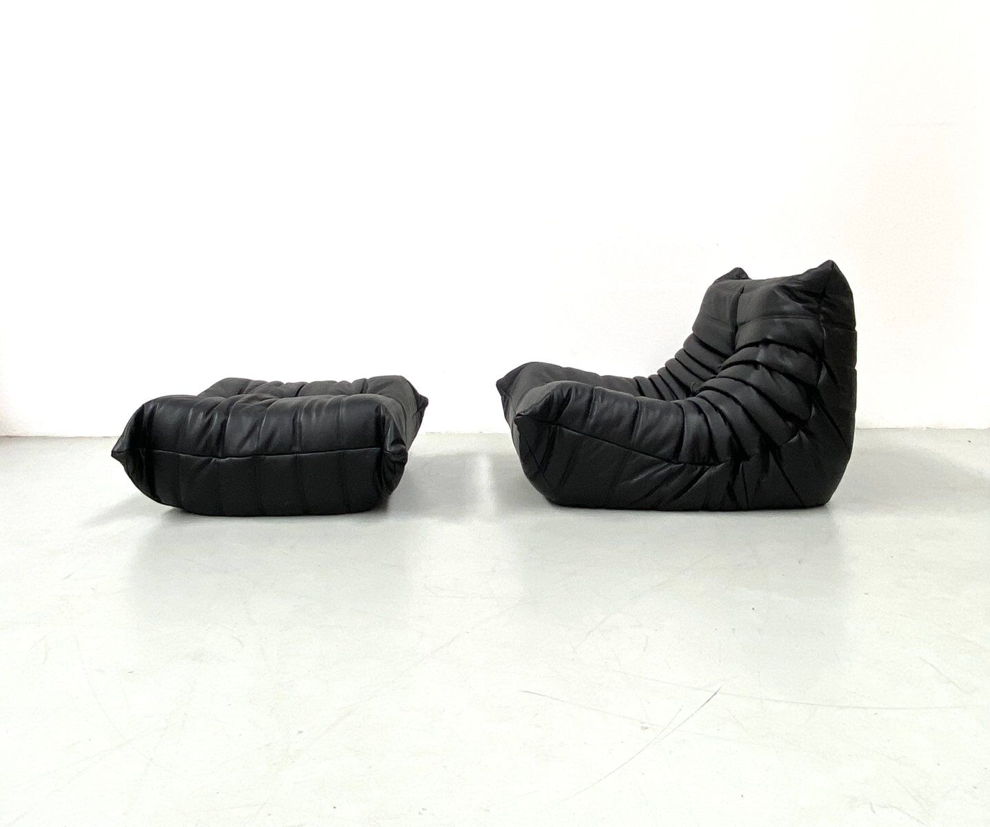 Togo chair and pouffe-black leather attributed to Ducaroy for Ligne Roset.