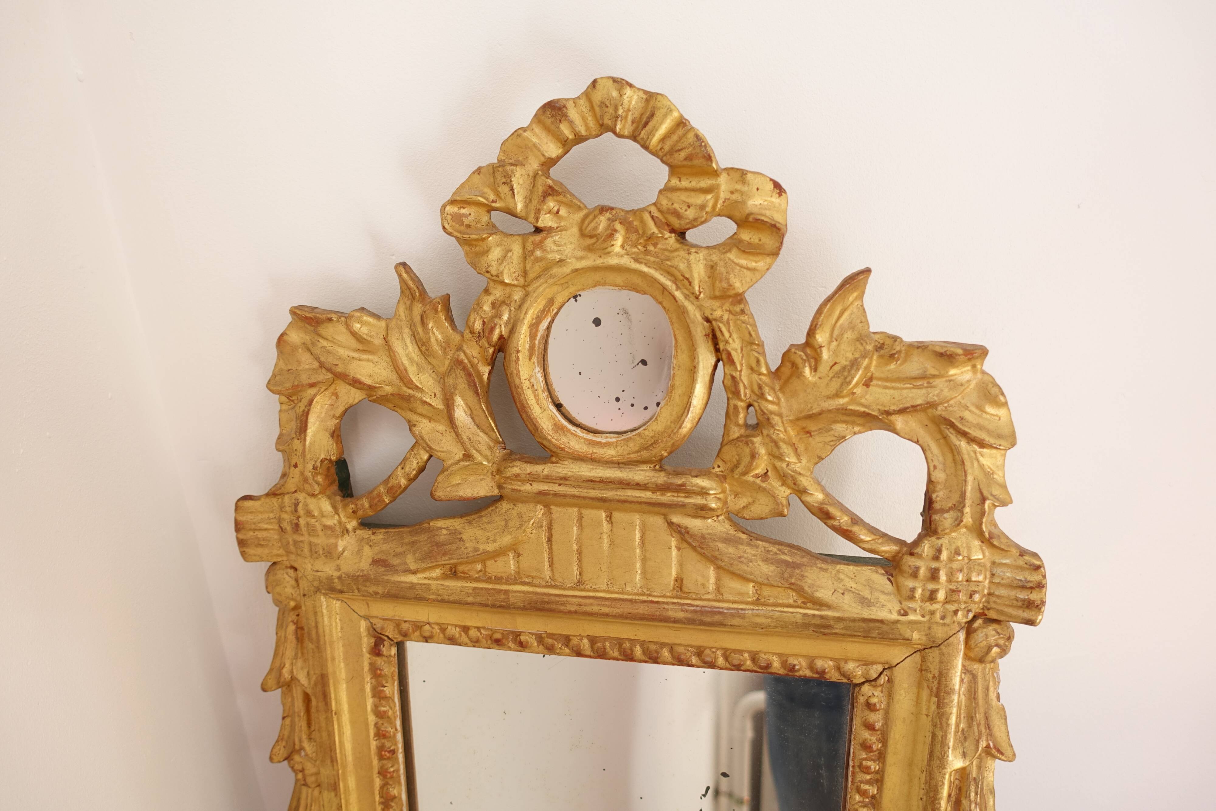 Miroir Louis XVI en bois doré 35x 65cm