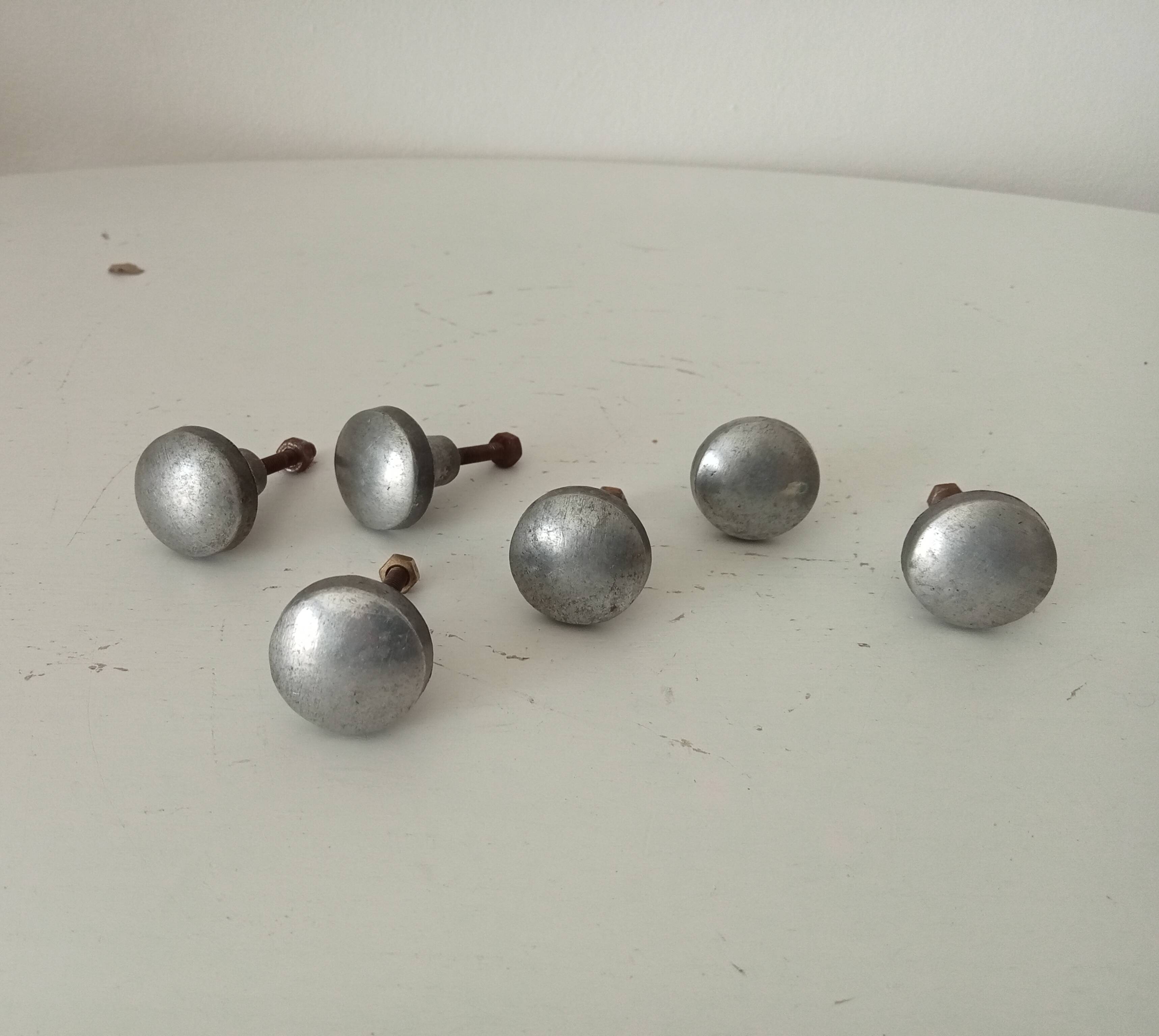 Pair of antique solid aluminium furniture handles.