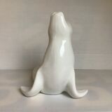 White earthenware sea lion in piggy bank