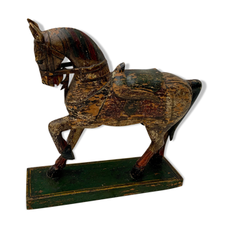 Carved polychrome wooden horse on painted wooden base late 19th to 20th century