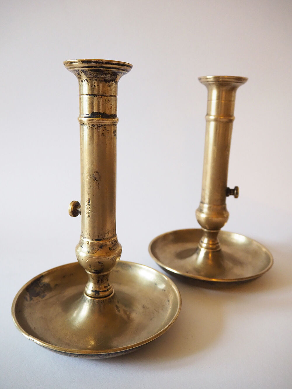 Set of three old brass candle holders
