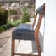 Antique wood bench and black imitation leather