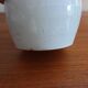 White enamelled earthenware flower vase signed HR