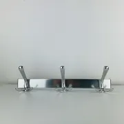 Wall-mounted coat rack, strip of 3 aluminium hooks from the 1960s.