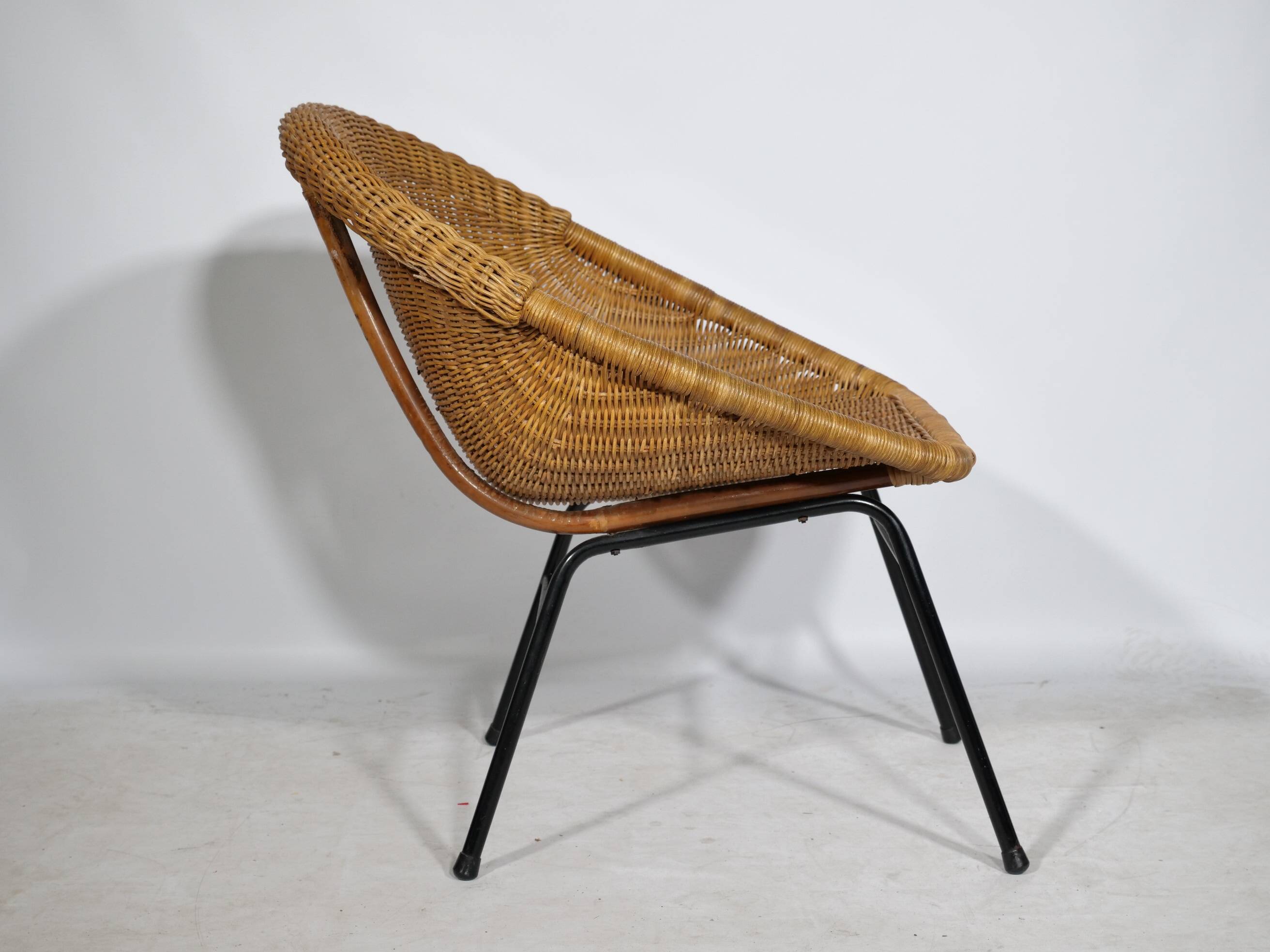 Woven rattan armchair from the 1960s