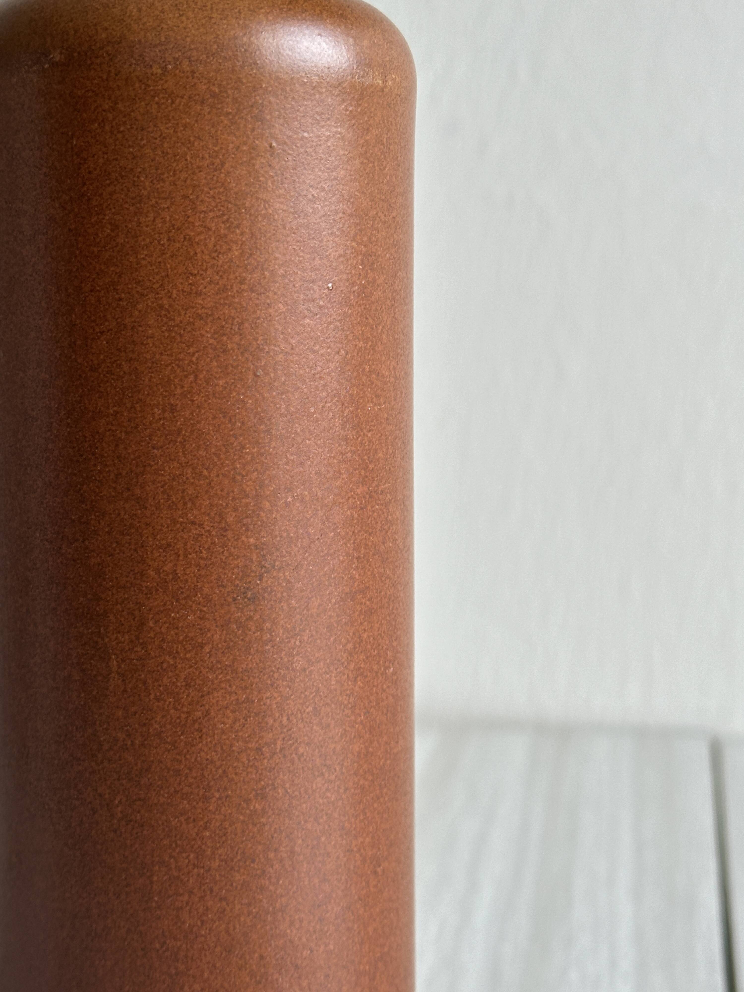 Decorative brown ceramic bottle.