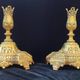 Pair of antique carved bronze candlesticks.