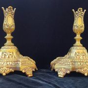 Pair of antique carved bronze candlesticks.