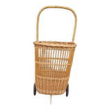 Vintage wicker log basket on vintage wheels