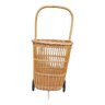 Vintage wicker log basket on vintage wheels