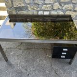 Vintage desk in smoked glass and brushed steel. 1970. Suspended box