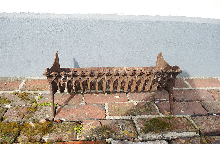 Old gate cradle with cast iron logs