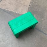 Postmodern plastic stool with a wood effect.