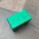 Postmodern plastic stool with a wood effect.