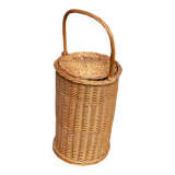 Round woven rattan and wicker umbrella holder with handle