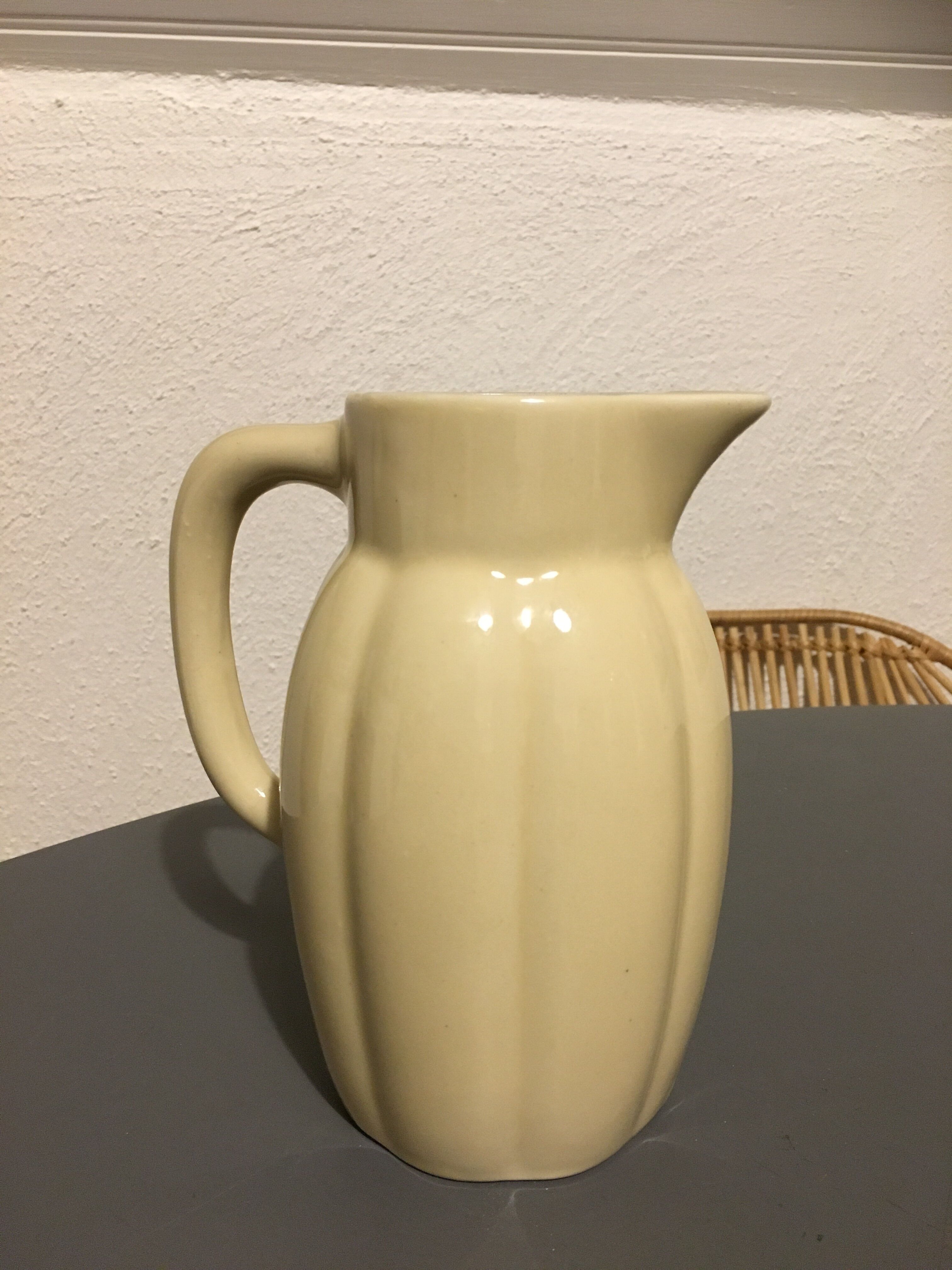 Cream color earthenware pitcher