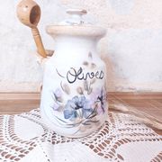 Old large vintage stoneware olive pot with its wooden spoon