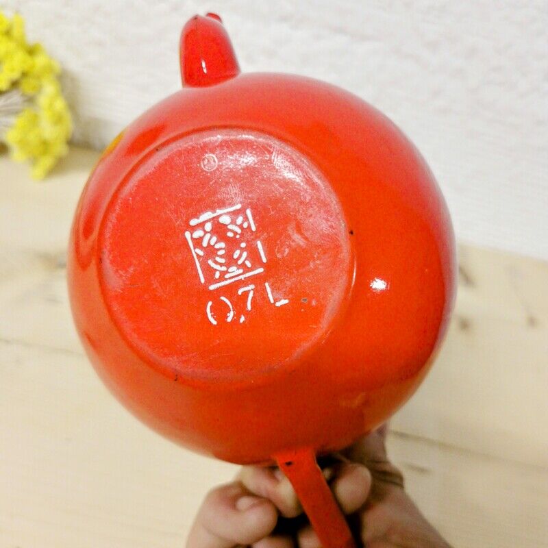 Red enamelled teapot