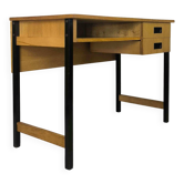 Vintage desk in modernist style made of wood.