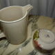 Hand-decorated art ceramic water jug and ramekin
