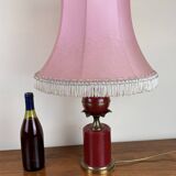 Art deco style desk lamp with a burgundy red sphere in the center the body is in lacquered iron