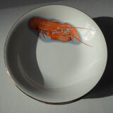 Eight hollow plates decorated with lobsters