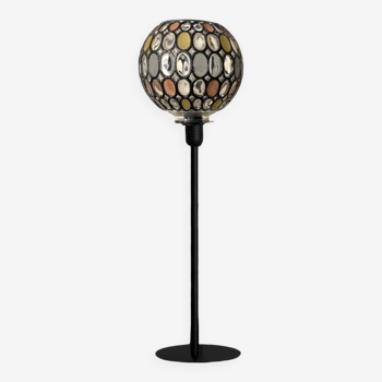 Table lamp with a vintage globe and a black base