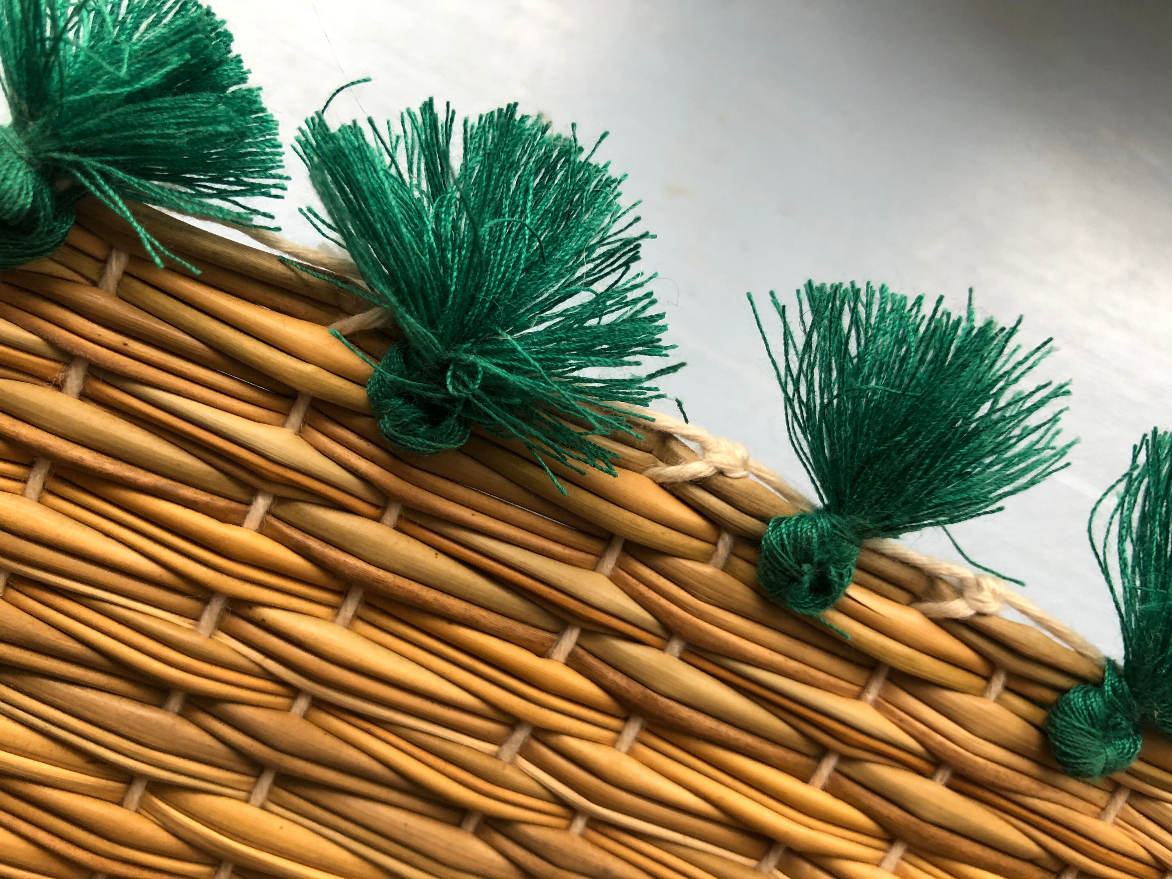 Braided placemats with pompoms