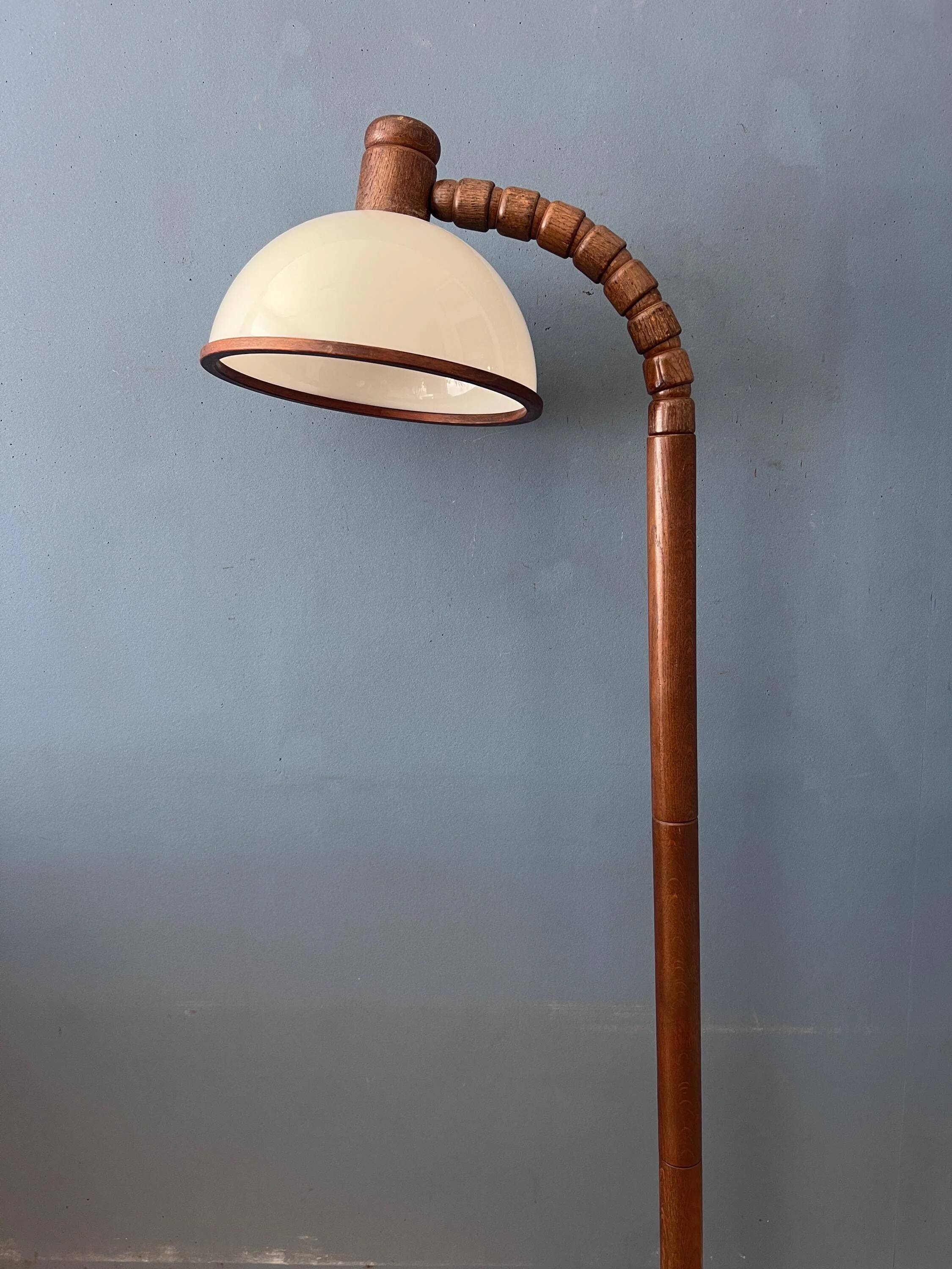 Mid-century floor lamp in brown wood by Steinhauer with an acrylic glass shade.