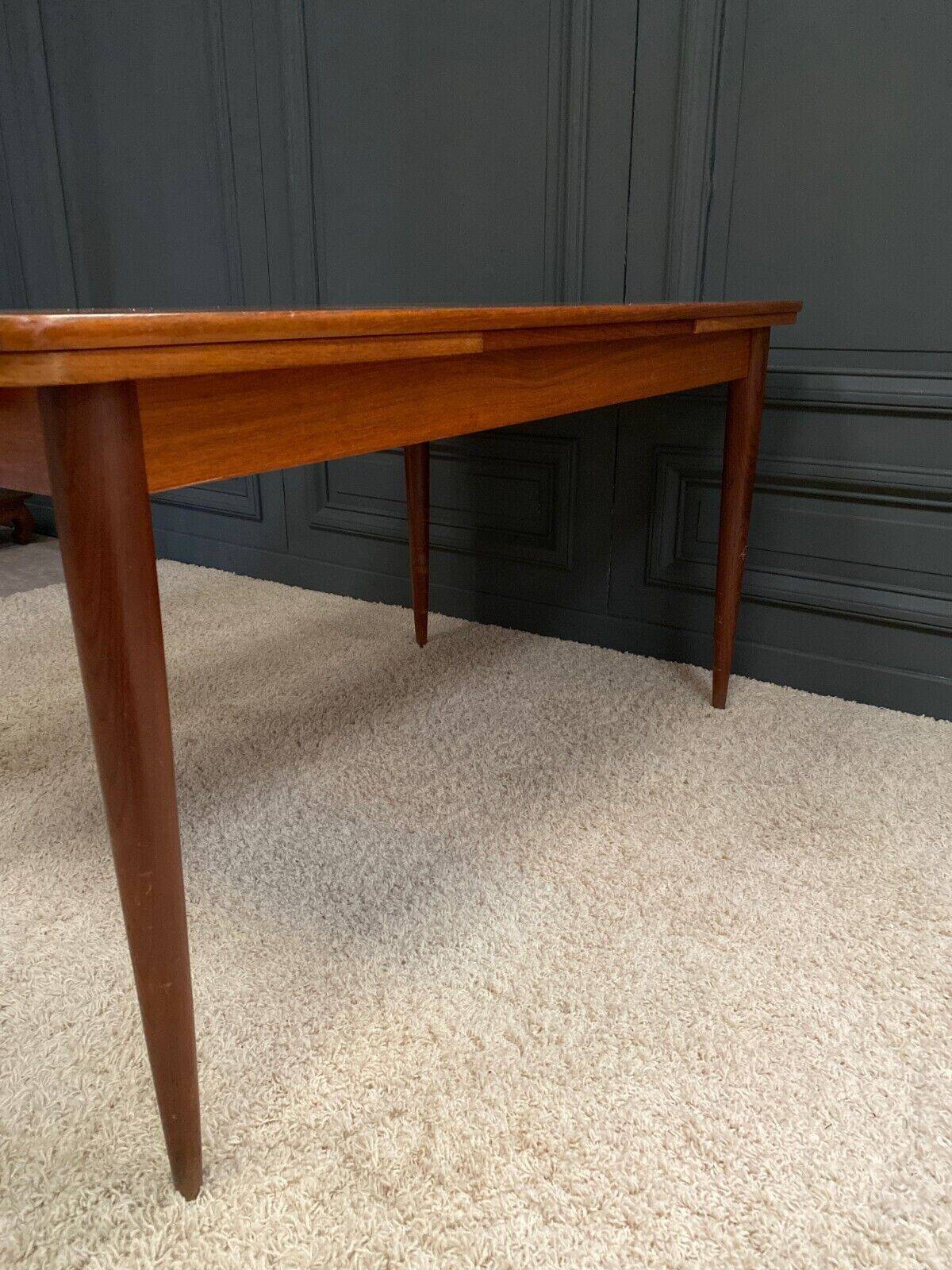 Scandinavian rectangular teak dining table with 4 tapered legs