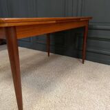 Scandinavian rectangular teak dining table with 4 tapered legs