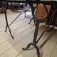 Pair of bistro tables in marble and cast iron.