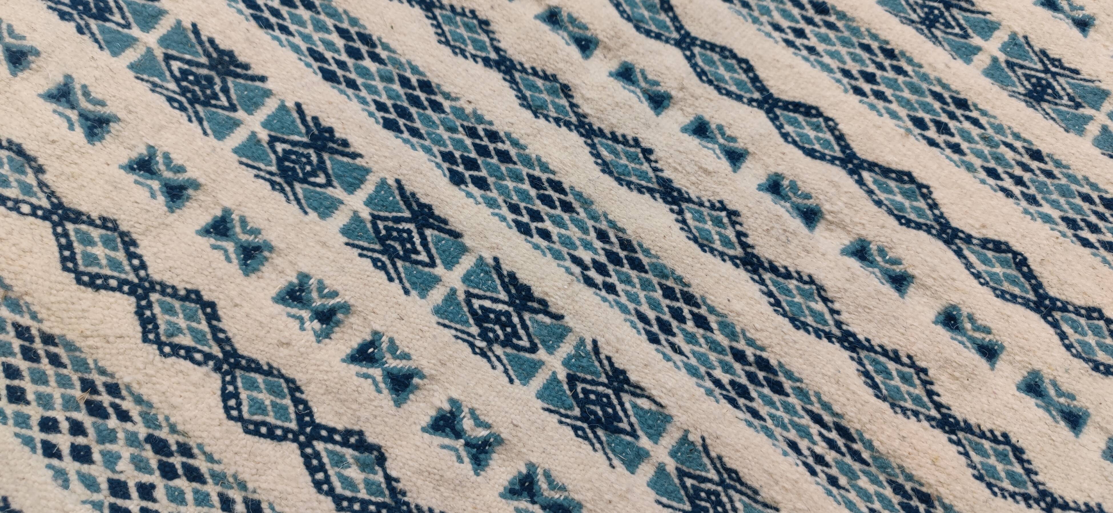 Traditional handmade white and blue carpet