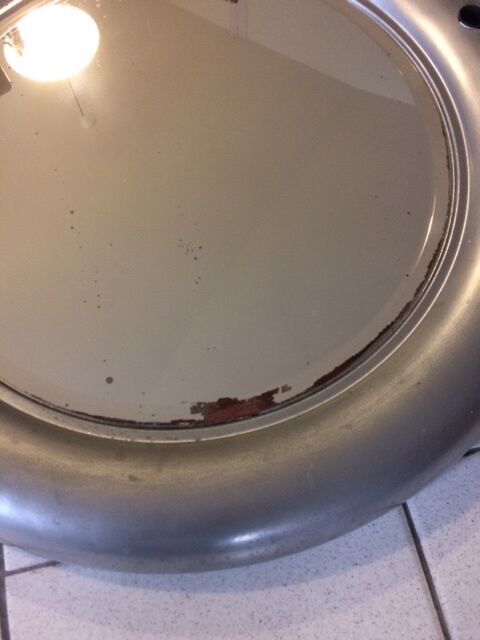 Vintage bright round bathroom mirror in metal