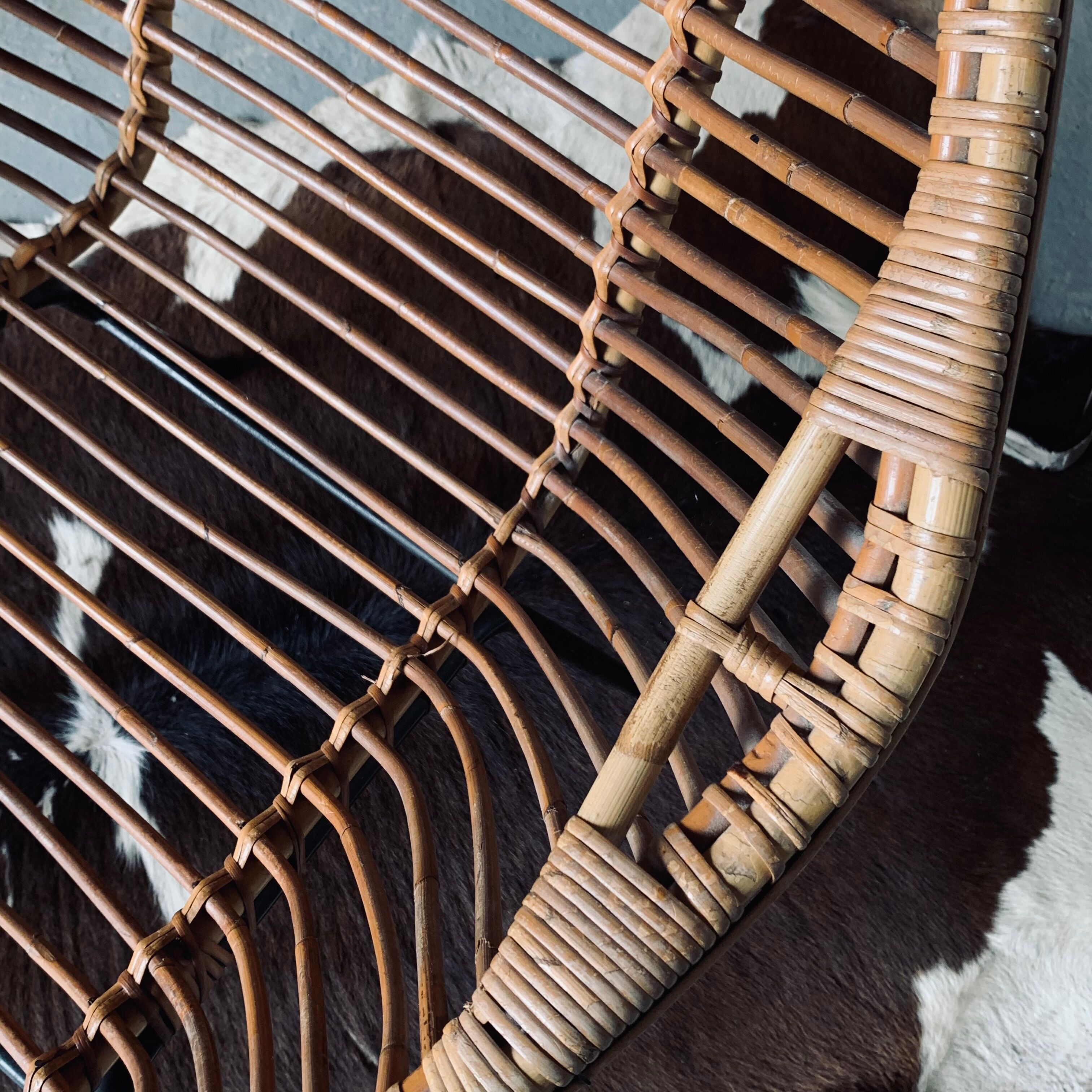 Rattan armchair and black metal base 1960