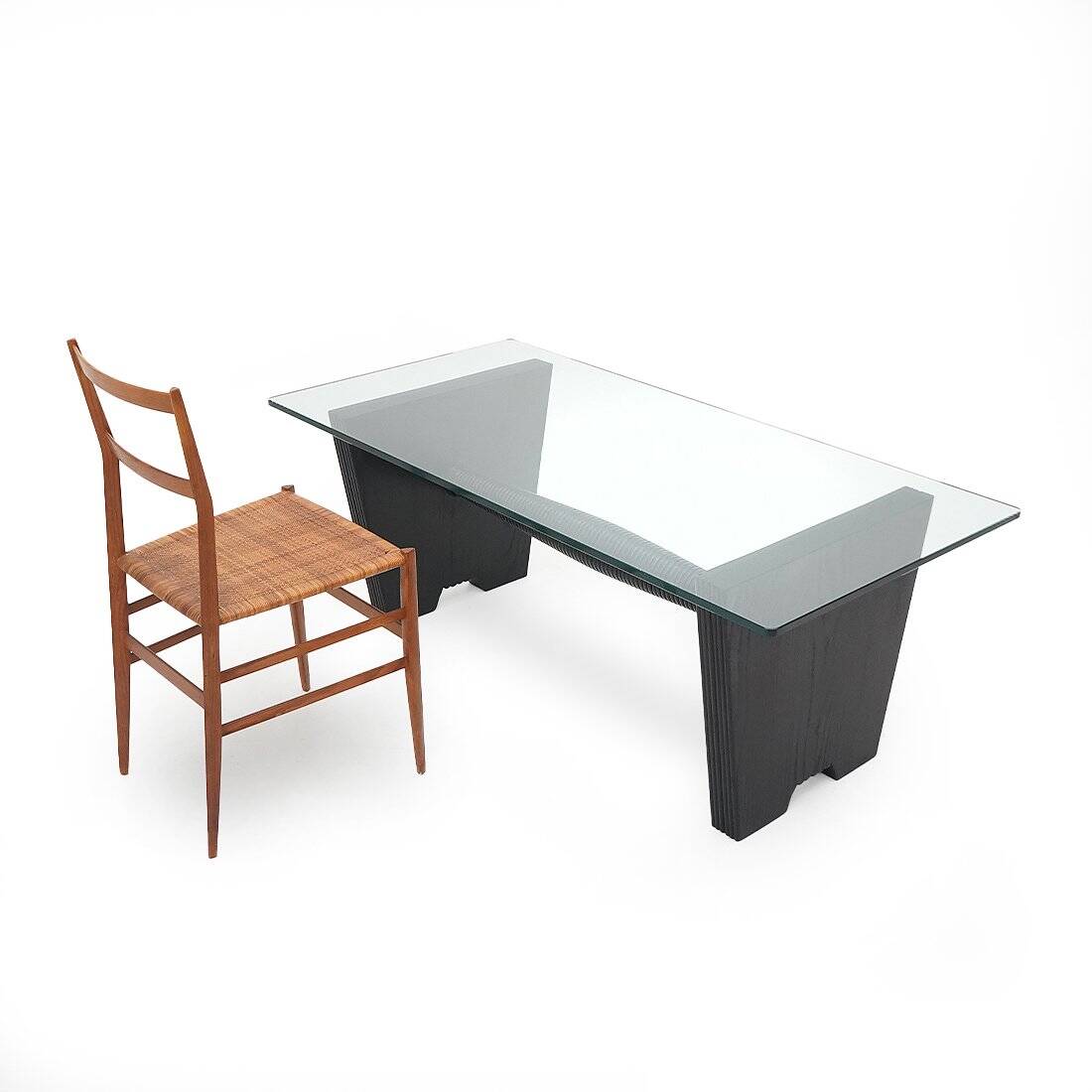 Coffee table with a glass top and black stained wood frame, 1930s.