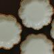 Set of eight small bread plates in white Limoges porcelain