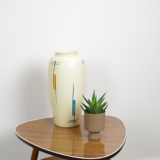 Vintage vase in light yellow porcelain