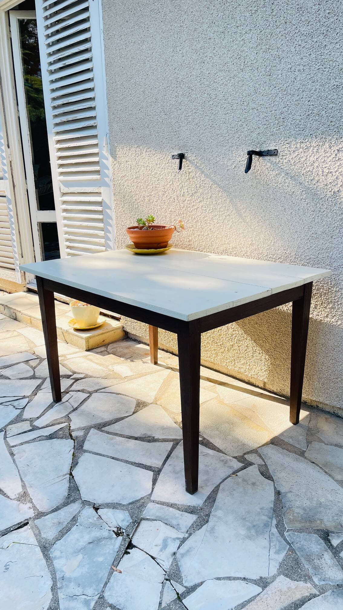 Vintage oak farmhouse table with a white top.