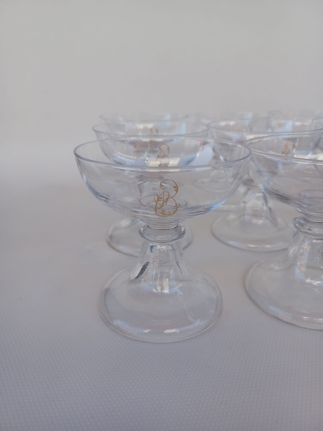 12 Val Saint Lambert crystal champagne glasses. Plain Bell Foot Service. Late 19th century.