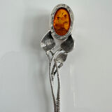 Silver spoon with amber