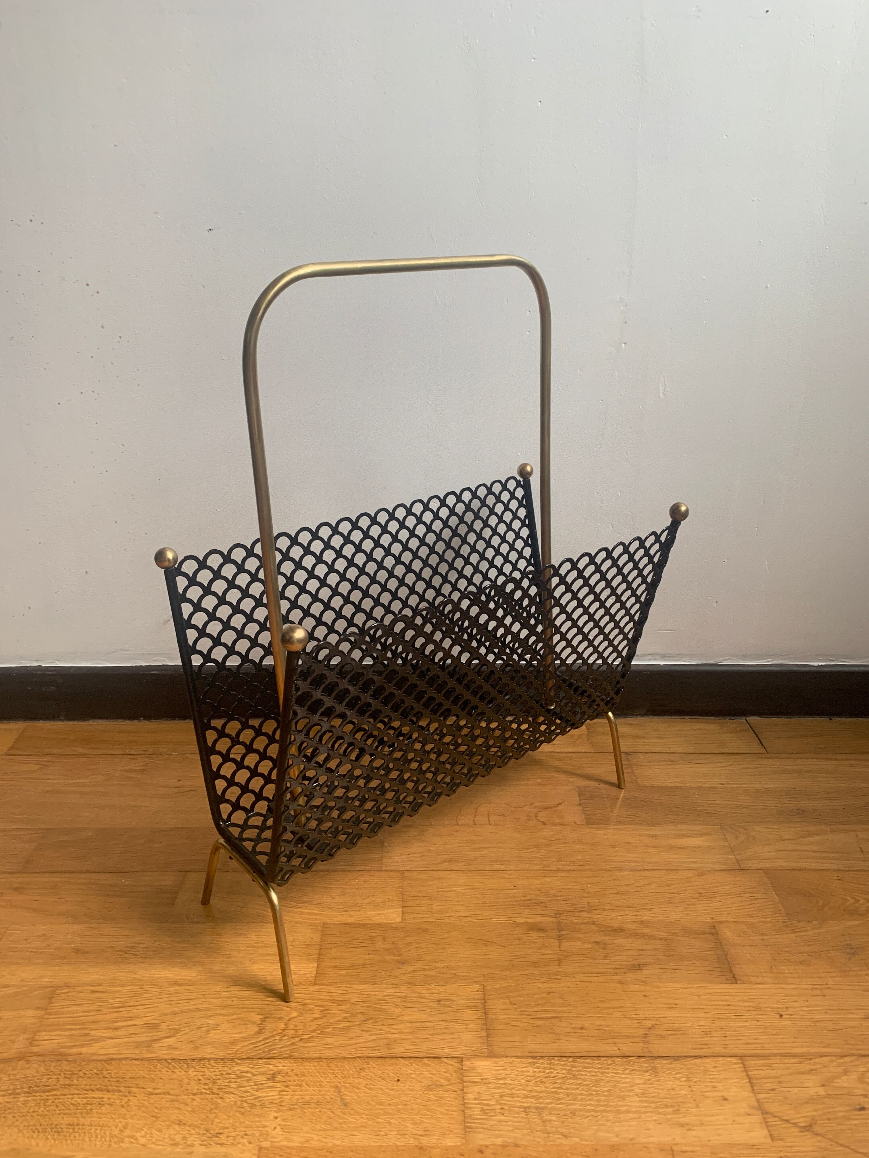 Perforated metal magazine door