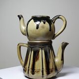 A pair of small vintage teapots in the Art Deco style reminiscent of Denbac.