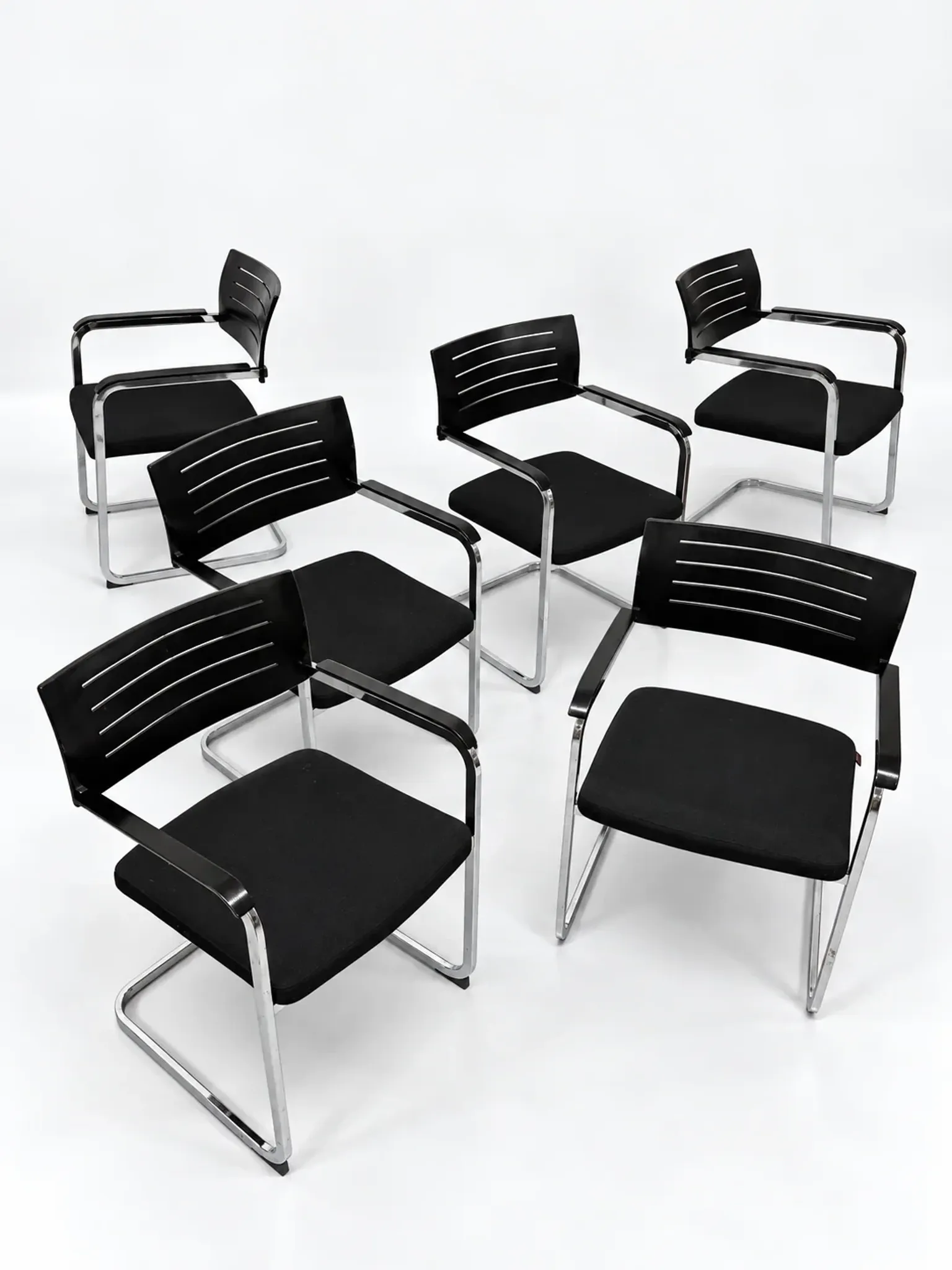 Set of 6 Züco cantilever chairs, black wood and chrome.