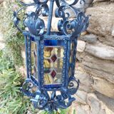Large antique wrought iron lantern with stained glass windows
