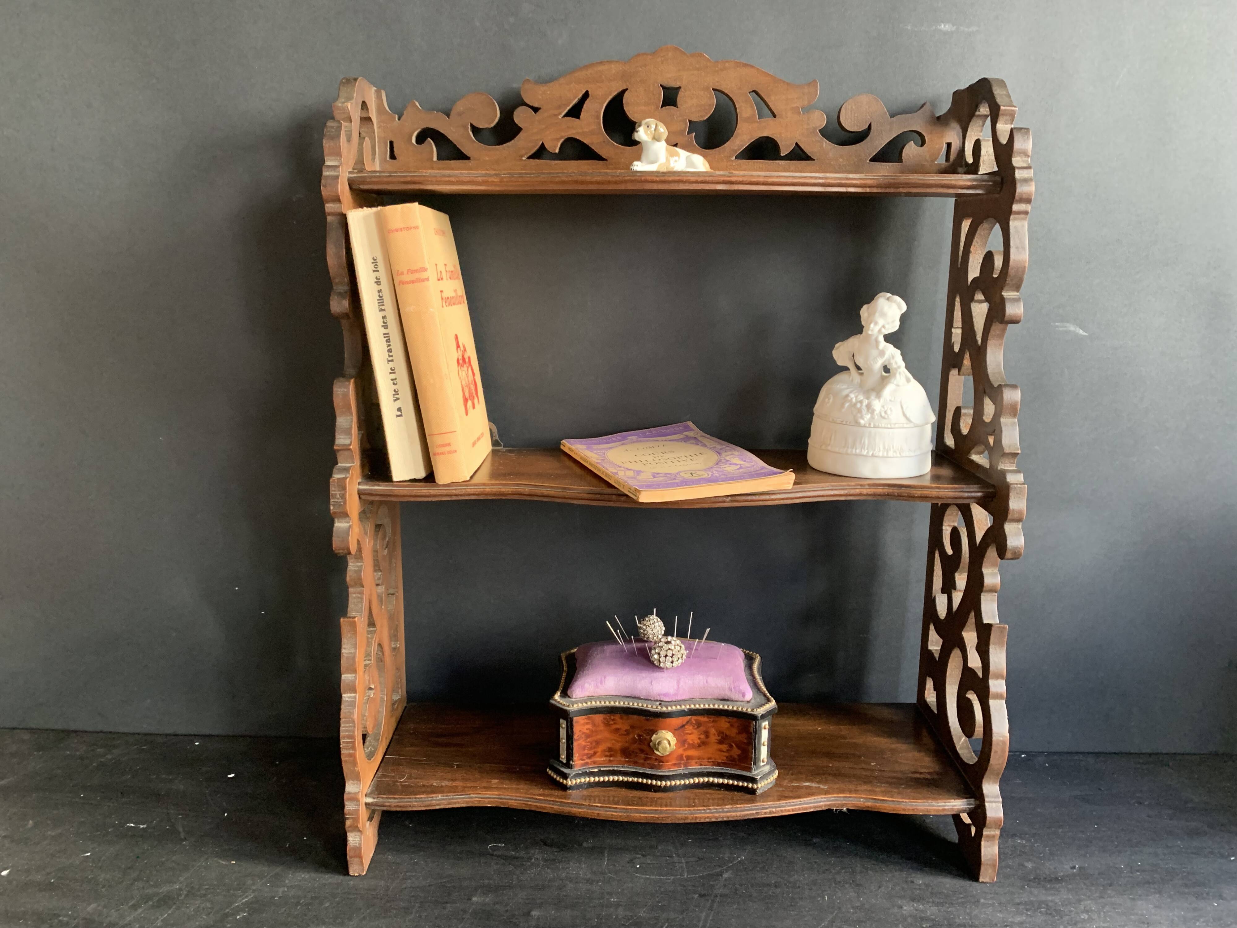 Antique shelf with openwork wooden pediment, early 20th century