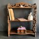 Antique shelf with openwork wooden pediment, early 20th century