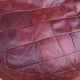 Pair of vintage poufs in burgundy leather patchwork, 1970